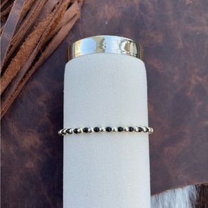 Black and 14kt gold plated beaded bracelet